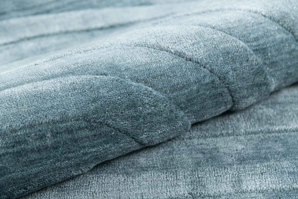 Curve Oval Dark Blue Wool And Bamboo Silk Handloom Carpet